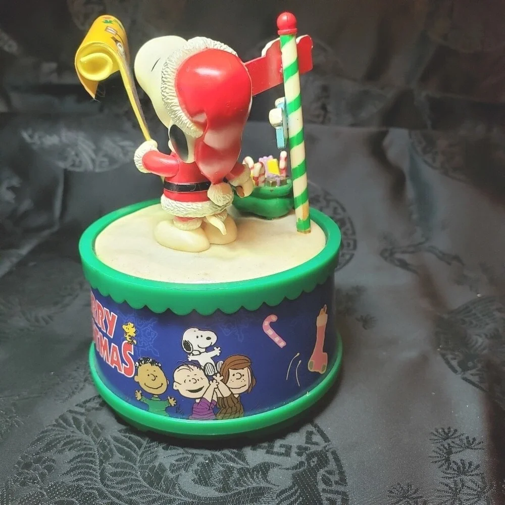 Snoopy as Santa checking his List‎ Music Box Play We Wish You A Merry Christmas